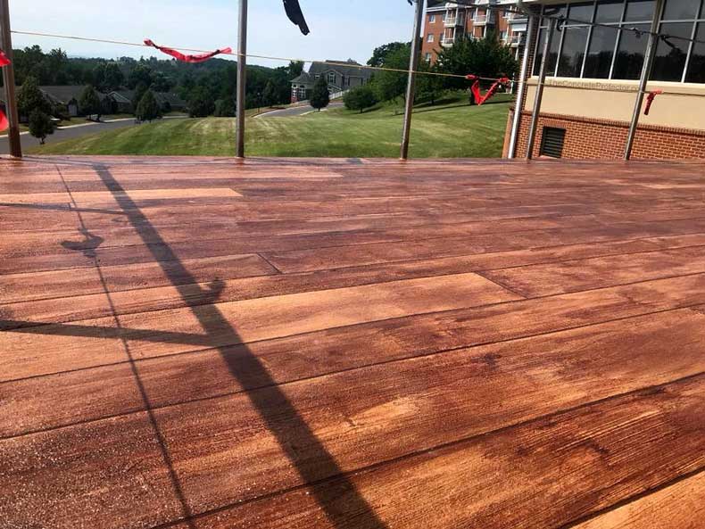 Rustic wood concrete is a perfect solution for those looking for a durable, long lasting, and beautiful flooring solution. Give us a call today for a free quote